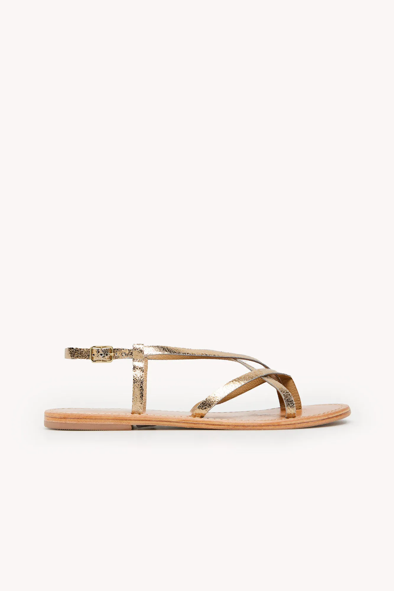 Melba. Sandalias planas de piel metalizada