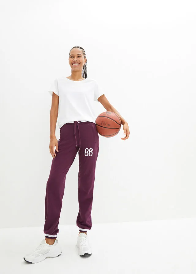 Pantalón deportivo con bolsillos con cierre morado intenso